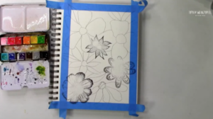 adding floral stamps and drawing flowers with pen