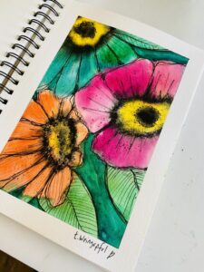 watercolor flowers in an art journal