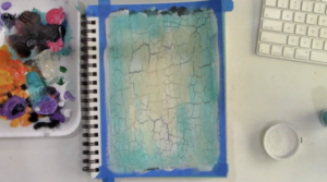 painting a background in an art journal