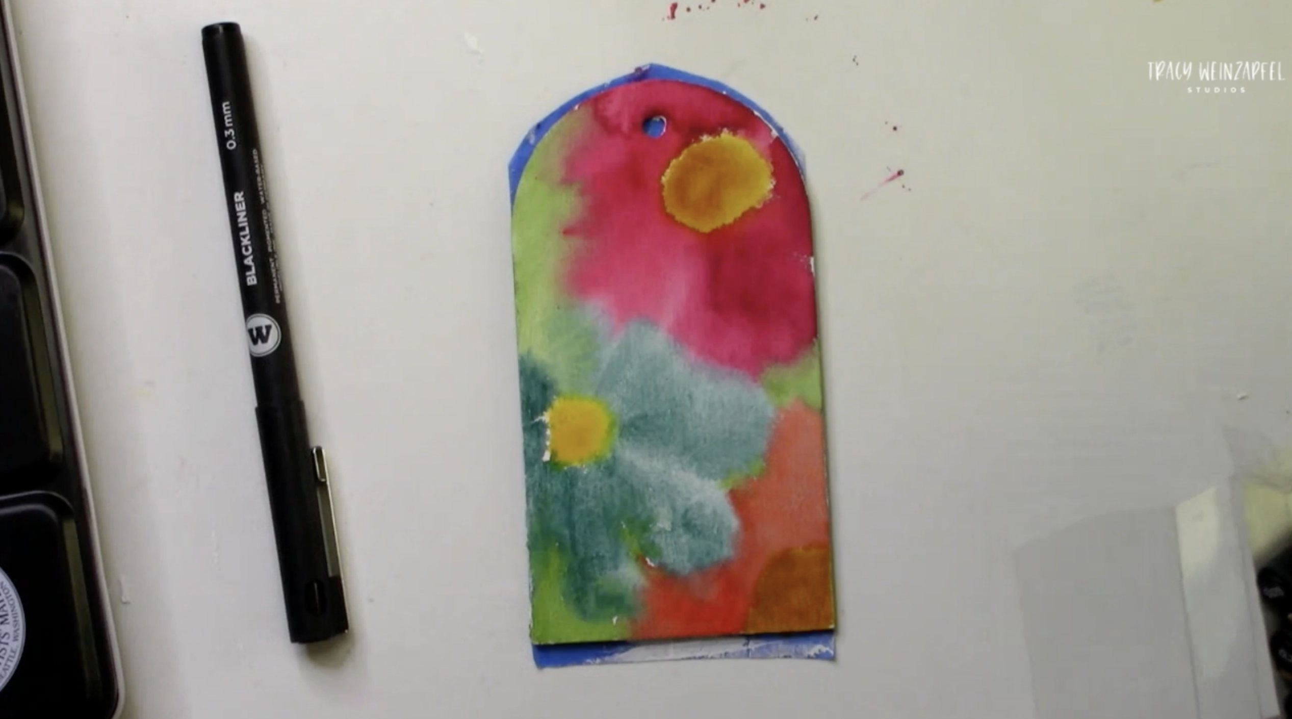 Adding watercolor paint to tag