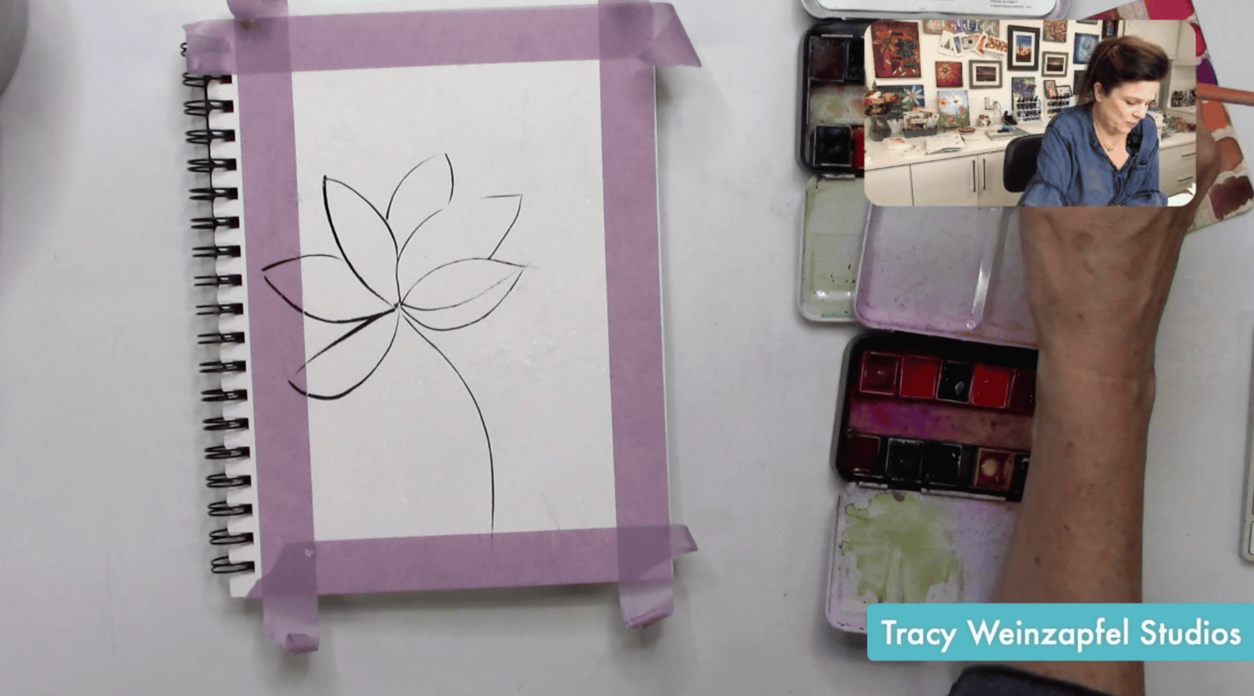 sketching a flower with black acrylic paint