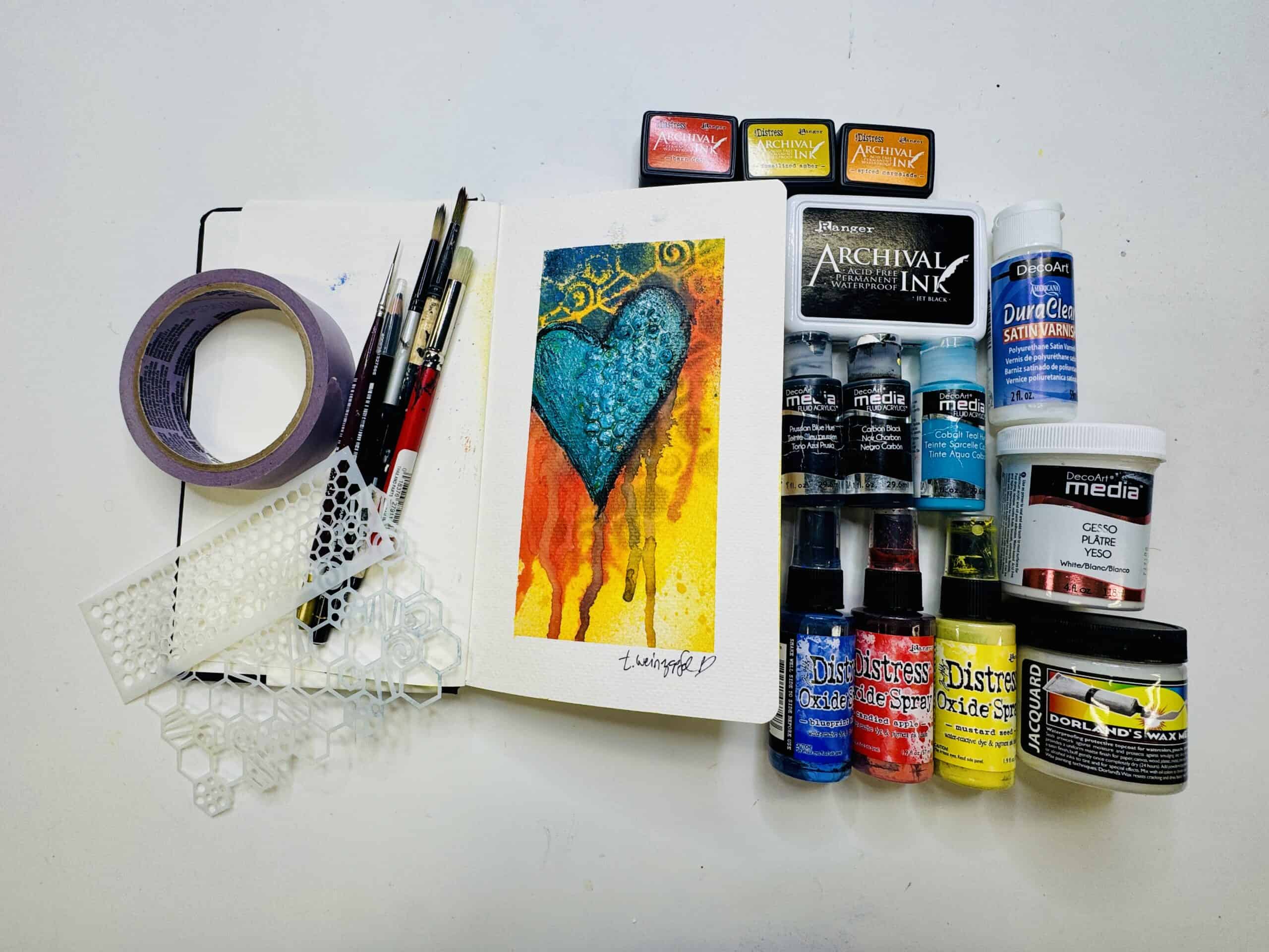Finished art journal page with supplies