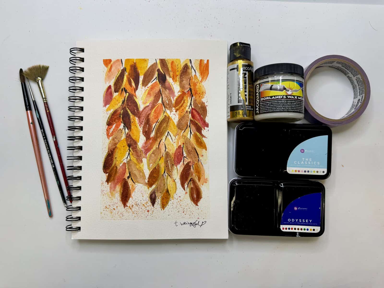 finished fall leaves art journal page with supplies